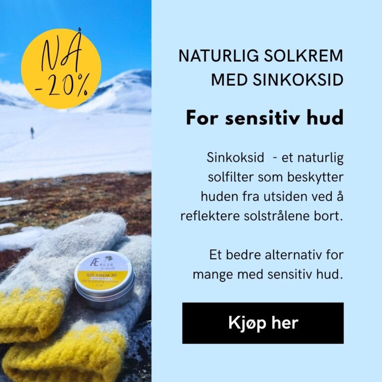 solkrem ligger på ullvott i snølandskap, blå himmel