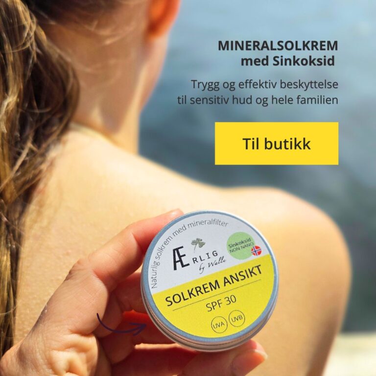 solkrem ansikt SPF 30 fra ærlig by walle holdes mot ryggen til jente, sjø i bakgrunn
