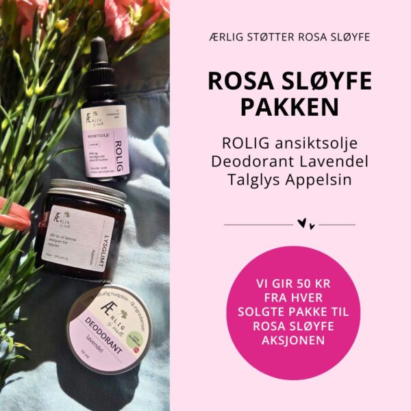 Tre produkter fra ærlig by Walle ligger med blomster på blå tekstil i naturlig lys