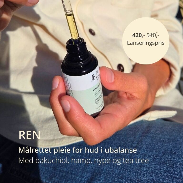 Hånd holder åpe pipetteflaske og viser innhold